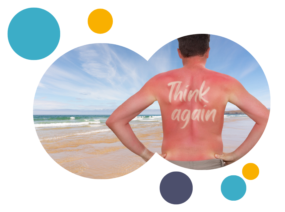 a burnt man on rhyl bean with sunscreen on his back that spells 'think again' 
