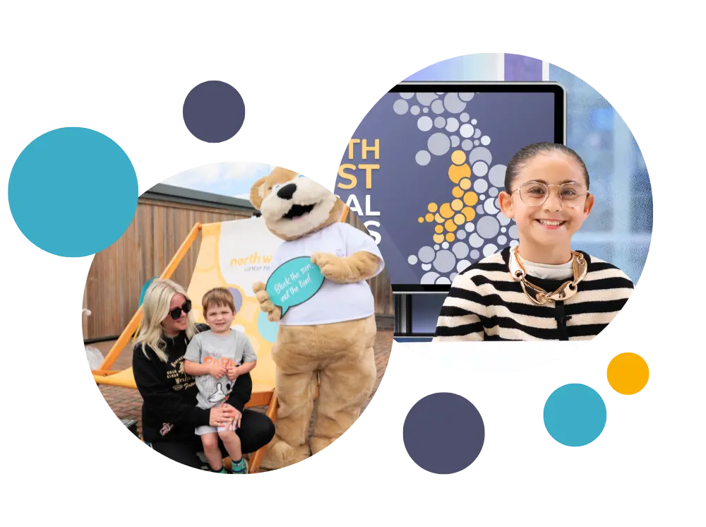 hope bear with a mother and child as they have just recieved some free sun cream 